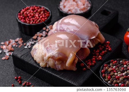 Chicken meat, raw boneless thigh fillets for grilling with salt. Raw chicken thigh fillets Chicken meat, raw boneless thigh fillets for grilling with salt. Raw chicken thigh fillets 135763098