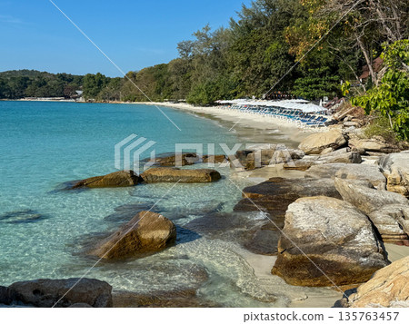 Rocky Tropical Beach with Clear Turquoise Water Rocky Tropical Beach with Clear Turquoise Water 135763457