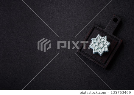 Christmas mochi, mooncake, or cheesecake shaped like a snowflake. Christmas mochi or cheesecake 135763469