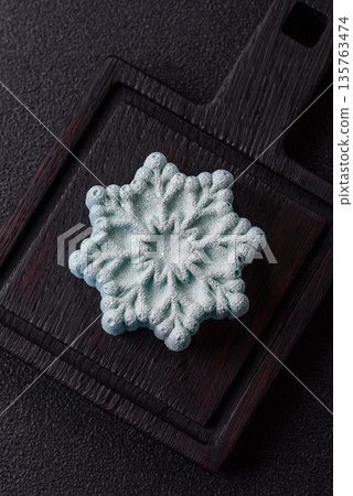 Christmas mochi, mooncake, or cheesecake shaped like a snowflake. Christmas mochi or cheesecake 135763474