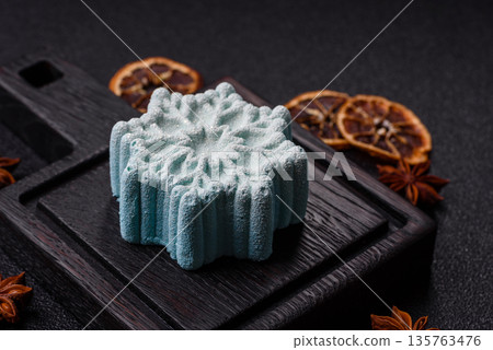 Christmas mochi, mooncake, or cheesecake shaped like a snowflake. Christmas mochi or cheesecake 135763476