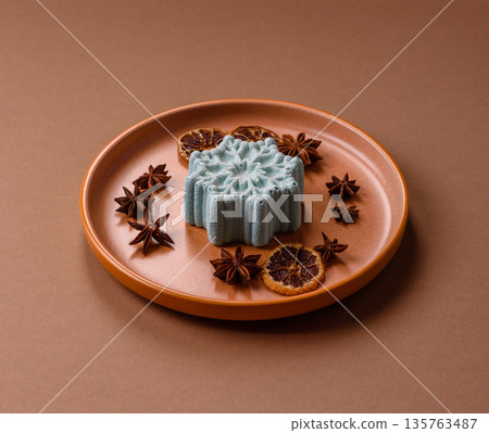 Christmas mochi, mooncake, or cheesecake shaped like a snowflake. Christmas mochi or cheesecake 135763487