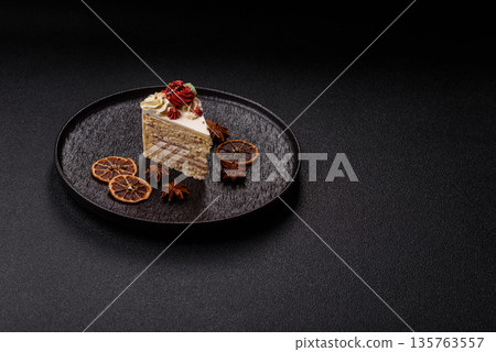A slice of sweet layered cake with white cream for a birthday or holiday. A slice of cake 135763557