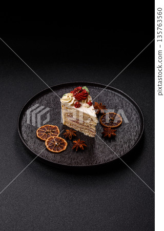 A slice of sweet layered cake with white cream for a birthday or holiday. A slice of cake A slice of sweet layered cake with white cream for a birthday or holiday. A slice of cake 135763560