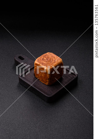 A French cube croissant with chocolate filling, a sweet breakfast pastry. Cube croissant A French cube croissant with chocolate filling, a sweet breakfast pastry. Cube croissant 135763561