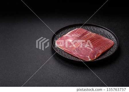 Meat, ham, jamon, or prosciutto sliced for breakfast bruschetta. Sliced ham, jamon, or prosciutto 135763737