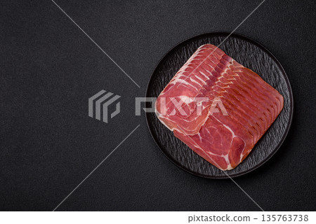 Meat, ham, jamon, or prosciutto sliced for breakfast bruschetta. Sliced ham, jamon, or prosciutto Meat, ham, jamon, or prosciutto sliced for breakfast bruschetta. Sliced ham, jamon, or prosciutto 135763738