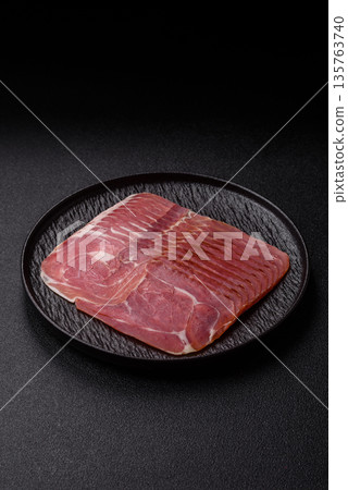 Meat, ham, jamon, or prosciutto sliced for breakfast bruschetta. Sliced ham, jamon, or prosciutto Meat, ham, jamon, or prosciutto sliced for breakfast bruschetta. Sliced ham, jamon, or prosciutto 135763740