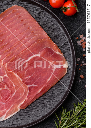 Meat, ham, jamon, or prosciutto sliced for breakfast bruschetta. Sliced ham, jamon, or prosciutto Meat, ham, jamon, or prosciutto sliced for breakfast bruschetta. Sliced ham, jamon, or prosciutto 135763747