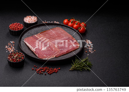 Meat, ham, jamon, or prosciutto sliced for breakfast bruschetta. Sliced ham, jamon, or prosciutto Meat, ham, jamon, or prosciutto sliced for breakfast bruschetta. Sliced ham, jamon, or prosciutto 135763749