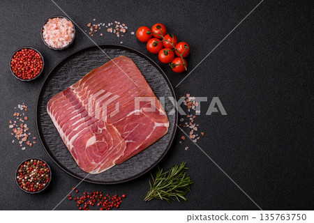Meat, ham, jamon, or prosciutto sliced for breakfast bruschetta. Sliced ham, jamon, or prosciutto Meat, ham, jamon, or prosciutto sliced for breakfast bruschetta. Sliced ham, jamon, or prosciutto 135763750