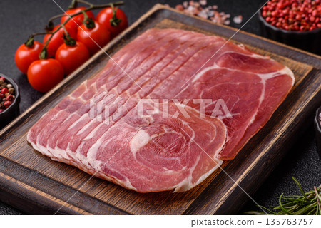 Meat, ham, jamon, or prosciutto sliced for breakfast bruschetta. Sliced ham, jamon, or prosciutto Meat, ham, jamon, or prosciutto sliced for breakfast bruschetta. Sliced ham, jamon, or prosciutto 135763757