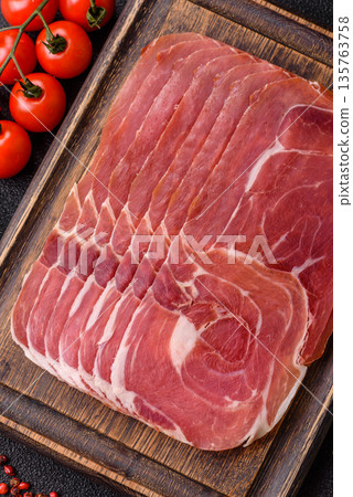 Meat, ham, jamon, or prosciutto sliced for breakfast bruschetta. Sliced ham, jamon, or prosciutto Meat, ham, jamon, or prosciutto sliced for breakfast bruschetta. Sliced ham, jamon, or prosciutto 135763758