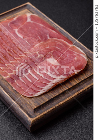 Meat, ham, jamon, or prosciutto sliced for breakfast bruschetta. Sliced ham, jamon, or prosciutto Meat, ham, jamon, or prosciutto sliced for breakfast bruschetta. Sliced ham, jamon, or prosciutto 135763763