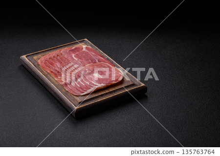 Meat, ham, jamon, or prosciutto sliced for breakfast bruschetta. Sliced ham, jamon, or prosciutto Meat, ham, jamon, or prosciutto sliced for breakfast bruschetta. Sliced ham, jamon, or prosciutto 135763764