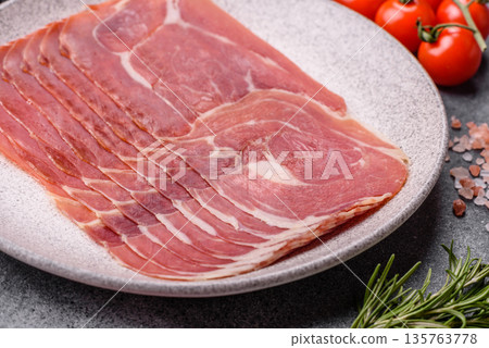 Meat, ham, jamon, or prosciutto sliced for breakfast bruschetta. Sliced ham, jamon, or prosciutto Meat, ham, jamon, or prosciutto sliced for breakfast bruschetta. Sliced ham, jamon, or prosciutto 135763778
