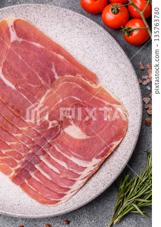 Meat, ham, jamon, or prosciutto sliced for breakfast bruschetta. Sliced ham, jamon, or prosciutto Meat, ham, jamon, or prosciutto sliced for breakfast bruschetta. Sliced ham, jamon, or prosciutto 135763780