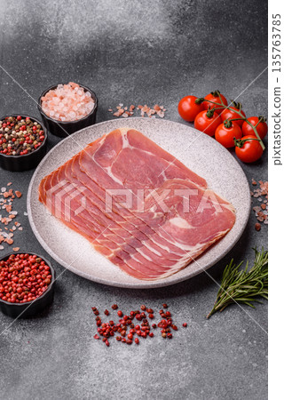 Meat, ham, jamon, or prosciutto sliced for breakfast bruschetta. Sliced ham, jamon, or prosciutto 135763785