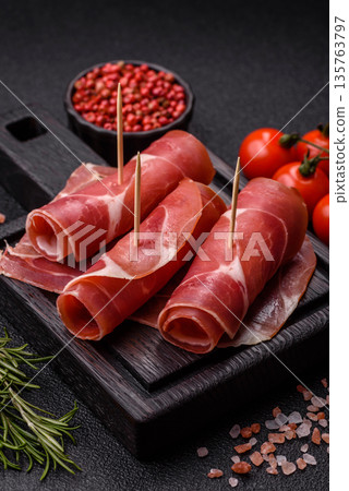 Meat, ham, jamon, or prosciutto sliced for breakfast bruschetta. Sliced ham, jamon, or prosciutto Meat, ham, jamon, or prosciutto sliced for breakfast bruschetta. Sliced ham, jamon, or prosciutto 135763797