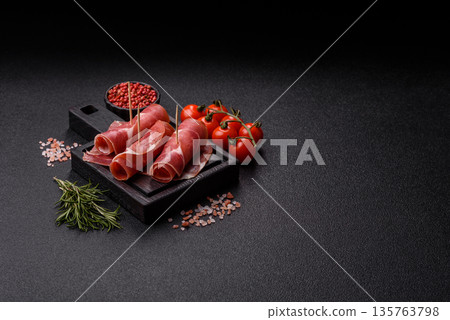 Meat, ham, jamon, or prosciutto sliced for breakfast bruschetta. Sliced ham, jamon, or prosciutto Meat, ham, jamon, or prosciutto sliced for breakfast bruschetta. Sliced ham, jamon, or prosciutto 135763798