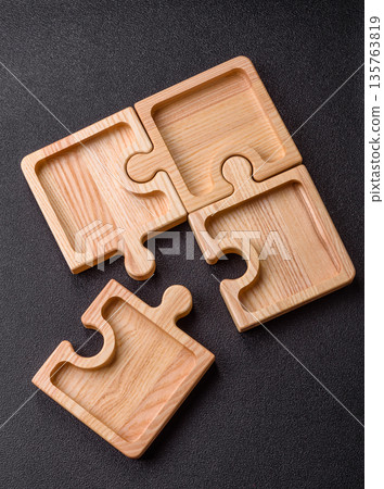 Wooden empty puzzle serving tray, kitchen accessories. A wooden empty puzzle tray 135763819