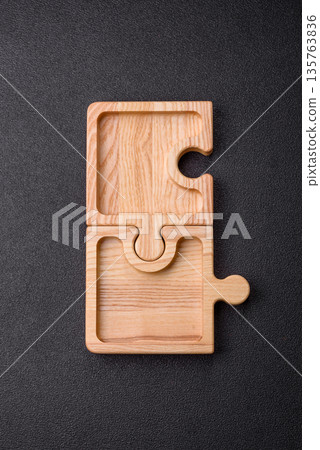 Wooden empty puzzle serving tray, kitchen accessories. A wooden empty puzzle tray Wooden empty puzzle serving tray, kitchen accessories. A wooden empty puzzle tray 135763836