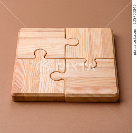 A wooden empty puzzle piece for a sign or business concept. A wooden empty puzzle A wooden empty puzzle piece for a sign or business concept. A wooden empty puzzle 135763846