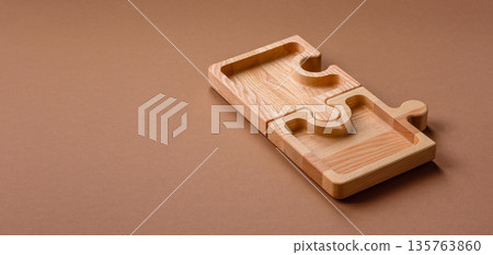 Wooden empty puzzle serving tray, kitchen accessories. A wooden empty puzzle tray Wooden empty puzzle serving tray, kitchen accessories. A wooden empty puzzle tray 135763860