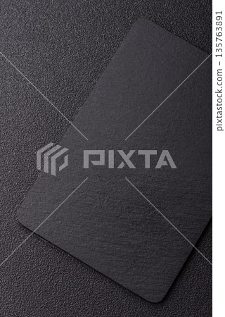 A black slate stone board or plate, an empty kitchen utensil. A black slate board 135763891