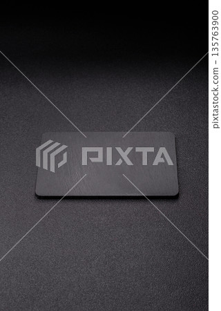 A black slate stone board or plate, an empty kitchen utensil. A black slate board 135763900