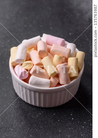 Mini marshmallows in white, pink, and pastel colors. Marshmallows as a food background 135763987