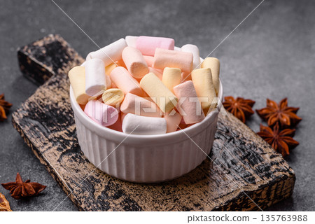 Mini marshmallows in white, pink, and pastel colors. Marshmallows as a food background Mini marshmallows in white, pink, and pastel colors. Marshmallows as a food background 135763988