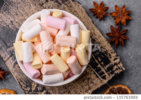 Mini marshmallows in white, pink, and pastel colors. Marshmallows as a food background 135763989