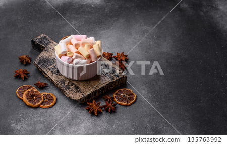 Mini marshmallows in white, pink, and pastel colors. Marshmallows as a food background 135763992