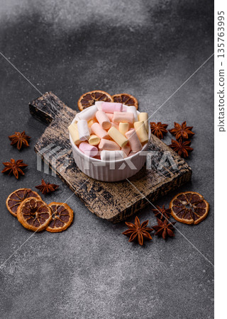 Mini marshmallows in white, pink, and pastel colors. Marshmallows as a food background Mini marshmallows in white, pink, and pastel colors. Marshmallows as a food background 135763995