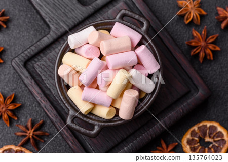 Mini marshmallows in white, pink, and pastel colors. Marshmallows as a food background 135764023