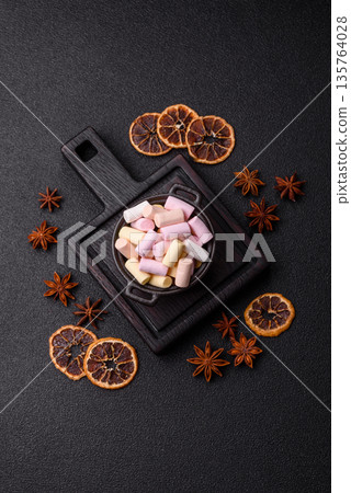 Mini marshmallows in white, pink, and pastel colors. Marshmallows as a food background Mini marshmallows in white, pink, and pastel colors. Marshmallows as a food background 135764028