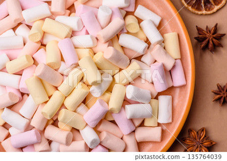 Mini marshmallows in white, pink, and pastel colors. Marshmallows as a food background 135764039