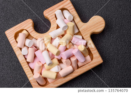 Mini marshmallows in white, pink, and pastel colors. Marshmallows as a food background 135764070
