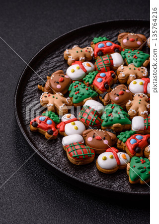 Gingerbread, Christmas cookies, and ornamental holiday baked goods. Christmas gingerbread Gingerbread, Christmas cookies, and ornamental holiday baked goods. Christmas gingerbread 135764216