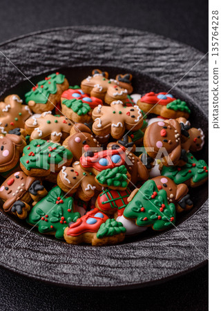 Gingerbread, Christmas cookies, and ornamental holiday baked goods. Christmas gingerbread Gingerbread, Christmas cookies, and ornamental holiday baked goods. Christmas gingerbread 135764228