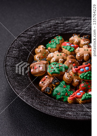 Gingerbread, Christmas cookies, and ornamental holiday baked goods. Christmas gingerbread Gingerbread, Christmas cookies, and ornamental holiday baked goods. Christmas gingerbread 135764229