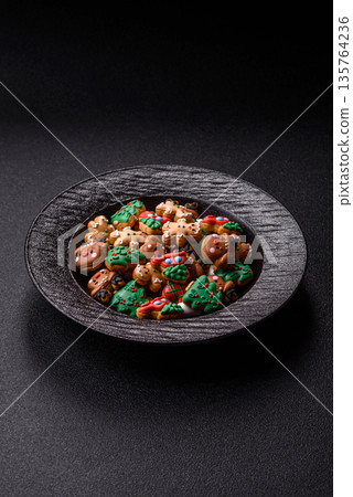 Gingerbread, Christmas cookies, and ornamental holiday baked goods. Christmas gingerbread Gingerbread, Christmas cookies, and ornamental holiday baked goods. Christmas gingerbread 135764236