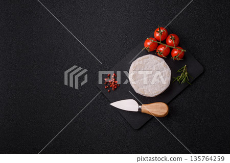 White French cream cheese Brie or Camembert for breakfast. Brie or Camembert cheese 135764259