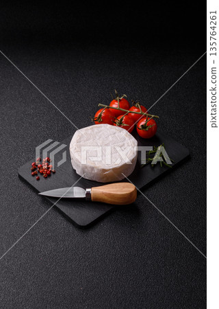 White French cream cheese Brie or Camembert for breakfast. Brie or Camembert cheese White French cream cheese Brie or Camembert for breakfast. Brie or Camembert cheese 135764261