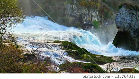Nature Scene With Cascades And Rocks, Dynamic River And Waterfall Scene Ideal For Storytelling And Photography Nature Scene With Cascades And Rocks, Dynamic River And Waterfall Scene Ideal For Storytelling And Photography 135764332