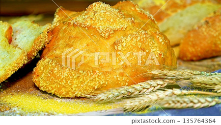 Cozy Farmmarket Scene Showcasing Handcrafted Rustic Bread On Linen With Wheat Stalks And Warm Sunlight Cozy Farmmarket Scene Showcasing Handcrafted Rustic Bread On Linen With Wheat Stalks And Warm Sunlight 135764364
