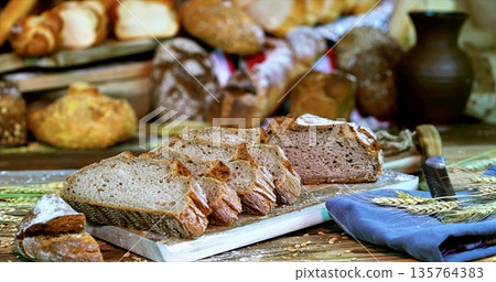 Baker Preparing Handcut Bread Samples, Closeup Of Handcrafted Rye Bread Slices On Wooden Board 135764383