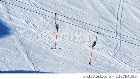 Snowy Landscapes With Lifts And Shadows, Quiet Ski Resort Amidst Snowy Slopes And Subtle Shadows 135764389