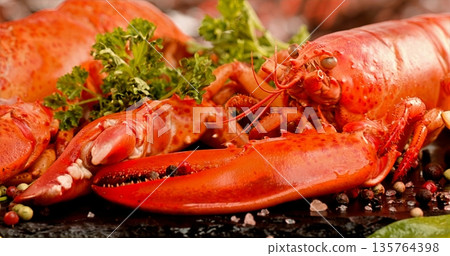 Luxurious Lobster With Garnishes, Gourmet Lobster Plate Decorated With Herbs And Citrus Slices Luxurious Lobster With Garnishes, Gourmet Lobster Plate Decorated With Herbs And Citrus Slices 135764398